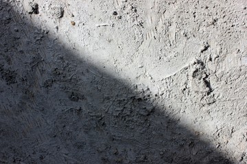 Gray wood background with a touch of cement. Vintage aged background. Gray stains. Designer vintage gray interior background wall of cement. Old texture grunge retro