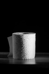 toilet paper roll on black background