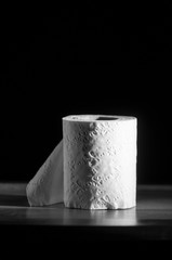 toilet paper roll on black background