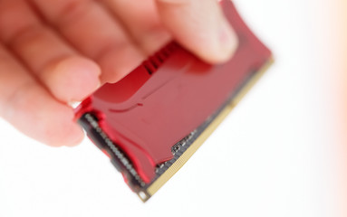computer memory in technic hand. White background.