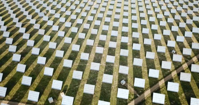 Modern solar power station in field, view from drone