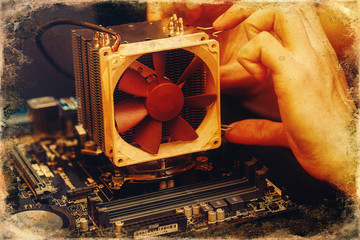 Repairman repairs the computer, Removing the computer motherboard.