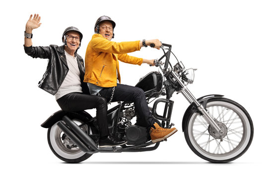 Two elderly men in leather jackets riding a chopper motorbike