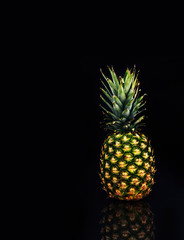 pineapple on black with reflection