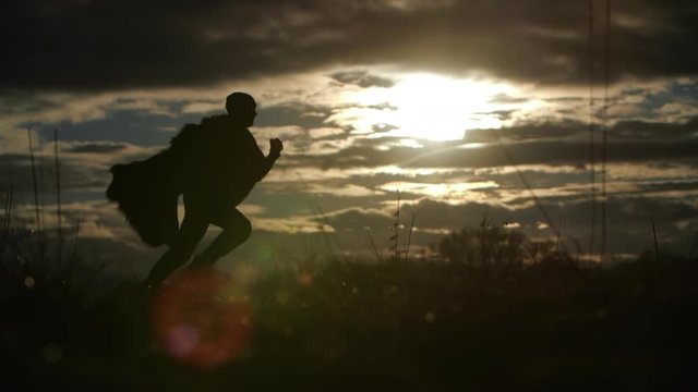 silhouette of running man in steppe in backlight, Ukraine