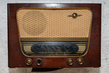 Vintage radio. Retro broadcast table radio receiver. Very old radio.