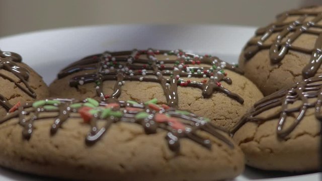 Adding sweet sprinkles on brown cookies