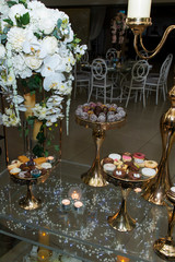 wedding cake with candles and flowers and sweet