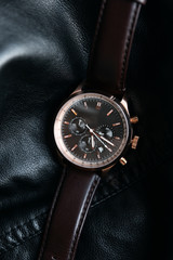 Gold LEATHER WATCH, VINTAGE STYLE WRIST WATCH, MEN'S LEATHER WATCH on leather background blur.