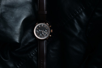 Gold LEATHER WATCH, VINTAGE STYLE WRIST WATCH, MEN'S LEATHER WATCH on leather background blur.