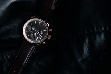 Gold LEATHER WATCH, VINTAGE STYLE WRIST WATCH, MEN'S LEATHER WATCH on leather background blur.