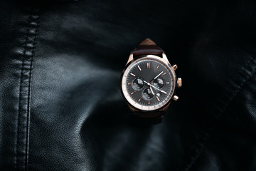 Gold LEATHER WATCH, VINTAGE STYLE WRIST WATCH, MEN'S LEATHER WATCH on leather background blur.
