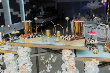 wedding cake with candles and flowers and sweet