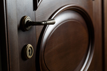 handle and keyhole  on a wooden door in beautiful lighting