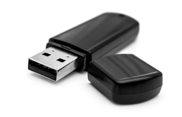Black flash drive on white background.