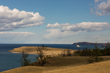 Lake Baikal. Beautiful autumn landscape of Lake Baikal with bright saturated sky, blue water.