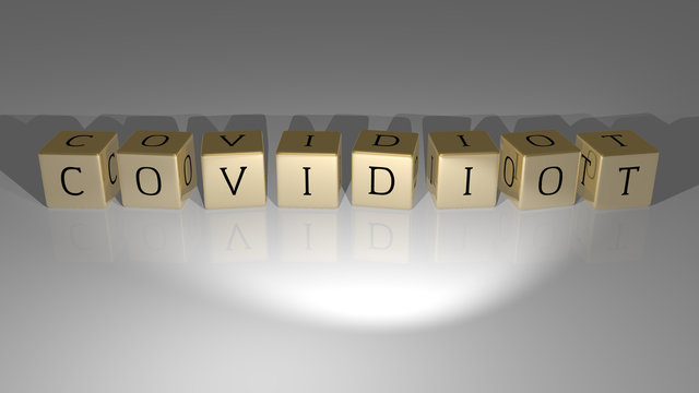 COVIDIOT arranged by golden cubic letters on a mirror floor, concept meaning and presentation