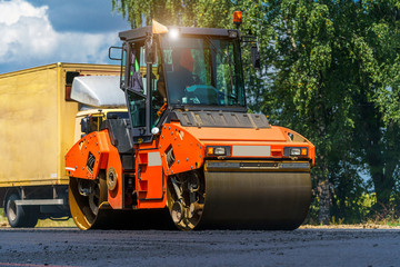 View on the road rollers working on the new road construction site. Selective focus on road repairing. Closeup