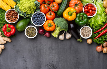 Healthy eating ingredients: fresh vegetables, fruits and superfood. Nutrition, diet, vegan food concept © Acronym