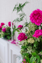 composition of bright pink peonies and greenery