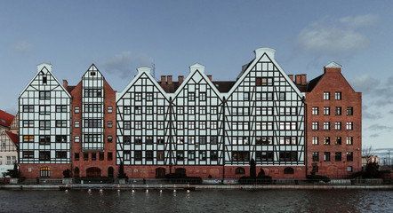 The old town of Gdansk (Gdańsk) in Poland (Polska) and the motlawa river with beautiful old polish stile houses.