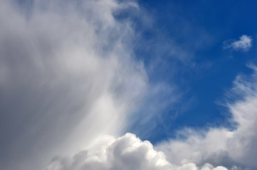 Blue sky background with dark clouds.