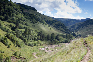 Fototapeta premium Abandoned village overlooking Mount Elbrus. Old house and amazing nature