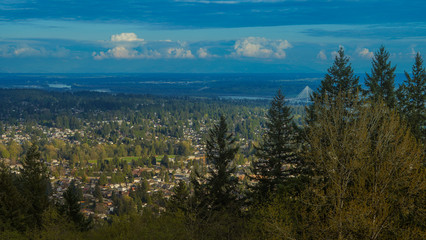 panoramic view across Fraser Valley over Fraser River and suspension bridges to Delta, BC

