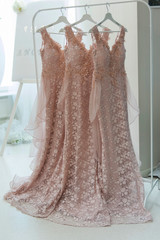 wedding dress hanging on hangers