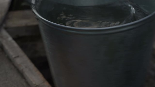 boy gets water from a well