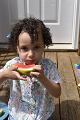Little girl eating watermelon