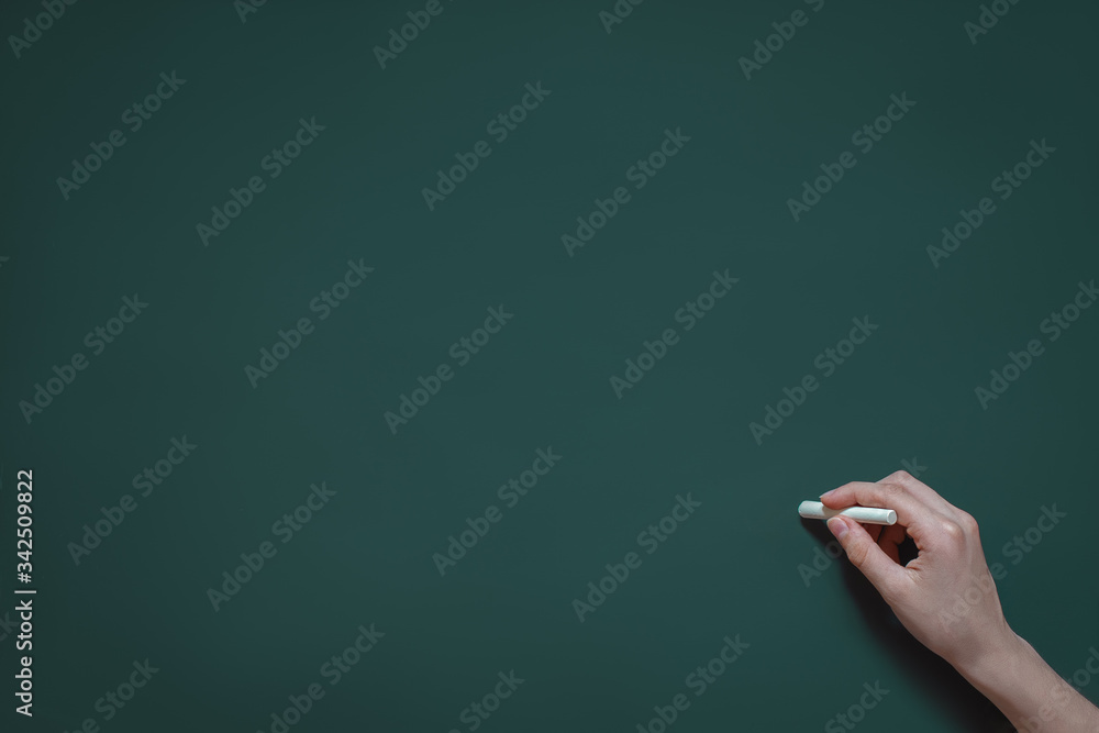 Wall mural hand writes in chalk on a blackboard, school class, study at school, college, new knowledge, place f