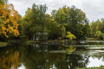 Fototapeta na wymiar colorful autumn landscape, lake with reflection of trees