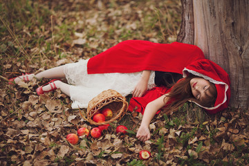 The girl in a red cape with a basket of apples. Snow White.