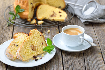 Frischer Hefe-Gugelhupf mit Marzipan und Amaretto-Rosinen  mit einer Tasse Kaffee Crema -  Fresh yeast ring cake with almond paste and raisins served with a cup of delicious coffee