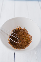 Mixing dalgona coffee cream in a bowl