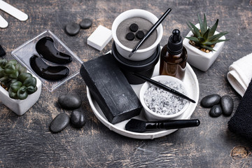 Fototapeta na wymiar Set of black charcoal detox cosmetics
