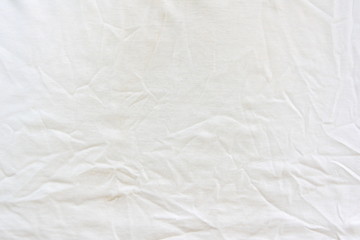 Crumpled white linen fabric cotton for wallpaper design. Brown weave cotton background texture.