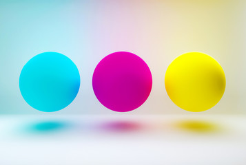 Multicolor dots on white background. Cyan, magenta, yellow spheres. 3d illustration.