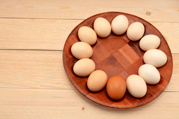 eggs on a dish on a wooden background