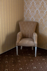 furniture. beige chair. soft chair by the bed