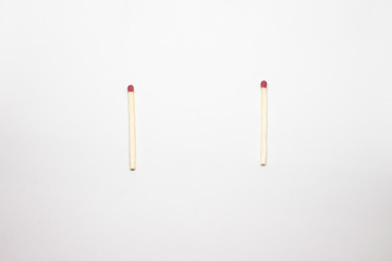 Two whole matches on a white background
