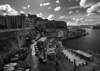 View of the coast of the capital of Valletta island of Malta. Walking along the ramparts. Black and white
