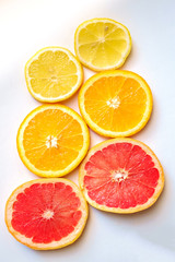 Fototapeta na wymiar slices of oranges and grapefruits