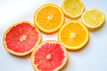Fototapeta na wymiar Slices of lemon, orange, grapefruit. Citrus pattern.
