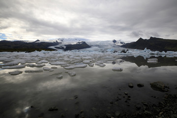 Fjallsarlon / Iceland - August 18, 2017: Fjallsarlon Glacier Lagoon view with ice formations, Iceland, Europe
