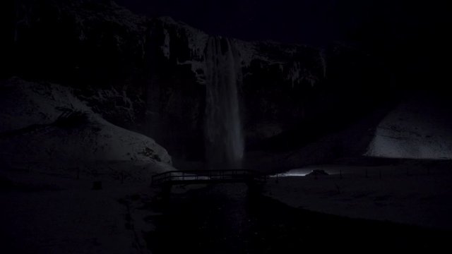 Sk&oacute;gafoss waterfall during a frosty night in Iceland. Winter and snowfall.
