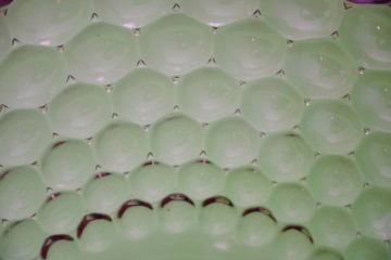 wave patterned glass bowl green gray background