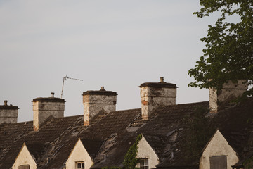 Old roofs with chimneys in London. House renovation