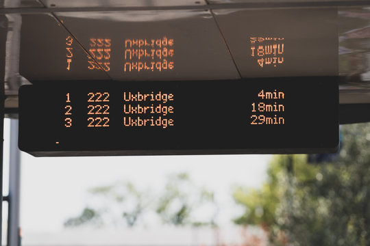Close-up of an electronic sign of a bus stop in public transport in Uxbridge, London, UK